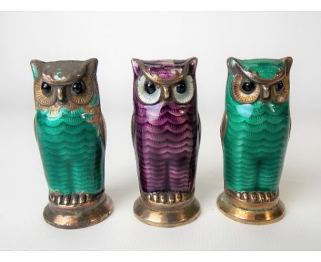 Three silver gilt and guilloche enamel owl modelled pepperettes by David Andersen, Norway (enamel AF).