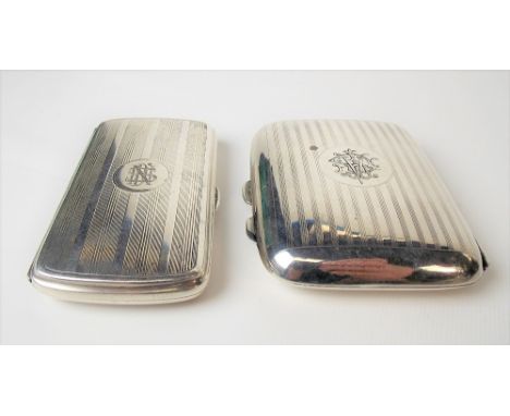 George V silver engine turned cigarette case, engraved monogram, width 8.5cm, Birmingham 1919; together with another engine t
