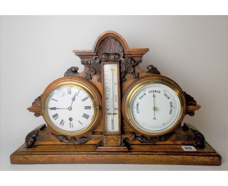 Victorian aneroid barometer thermometer &amp; timepiece within carved oak case, height 33.5cm