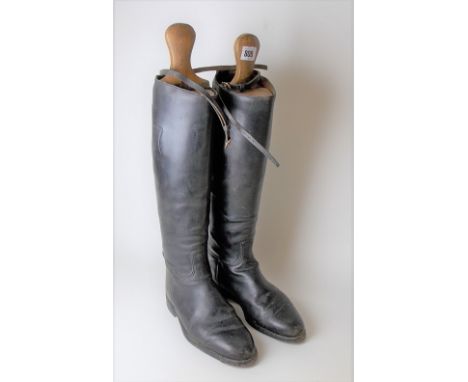 Pair of black leather hunting boots with boot lasts, size 5