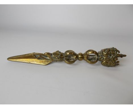 Burmese brass ceremonial dagger with T section blade coming out the mouth of the beast, double ring handles and cast with a t