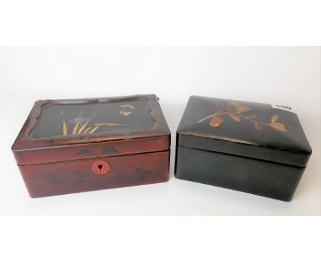 Japanese black lacquer rectangular box, the lid painted with a flower; together with a red and black lacquer hinge lidded tea