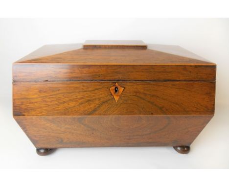 19th Century rosewood boxwood strung tea caddy of sarcophagus form, the quarter veneered hinge-lid revealing a pair of hinge-