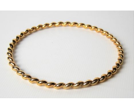 9ct hallmarked gold twist bangle, weight 18g approx.