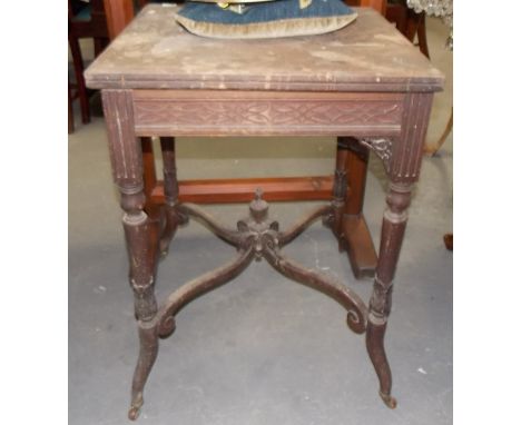 Edwardian mahogany envelope card table with single drawer and blind fret frieze upon cylindrical turned foliate carved suppor