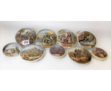 Eight various 19th Century Prattware pot lids together with a 19th Century glass souvenir paperweight (9)
