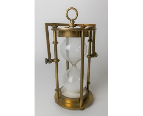 Brass gimballed twenty minute sand timer, height 14cm.