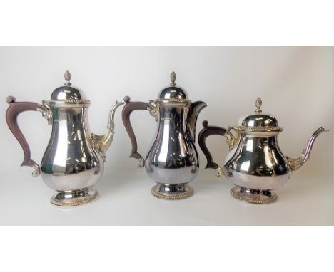 Modern silver matching teapot, coffee pot and hot water jug by Mappin &amp; Webb, of pear pedestal form, the domed lids with 