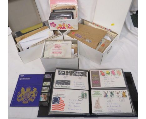 Two white boxes containing envelopes with franked British stamps, Jersey commemorative franked and unfranked stamps, first da