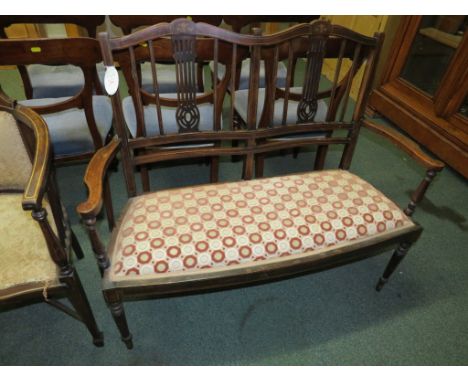 Edwardian mahogany and boxwood strung two-seater settee with stick back, turned baluster supports, the seat in more recent cr