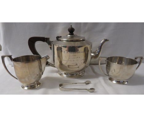 A silver three-part tea set comprising teapot with fruitwood handle and knop and 1943 presentation inscription (gross weight 