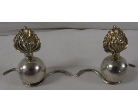 A pair of Grey &amp; Co filled silver menu holders modelled as Grenadier Guards type grenades, ball and crest, height 5cm, ea