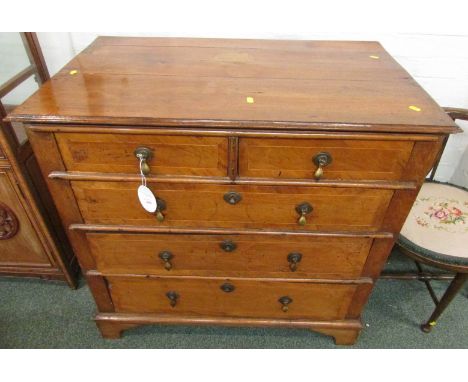 An early Georgian walnut veneer chest of two short over three long drawers, the drawer fronts with boxwood stringing and bras