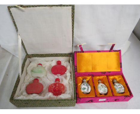 A matched set of four Chinese 20th century decorative snuff bottles, ceramic, glass and hardstone, the tallest 6.2cm, with a 
