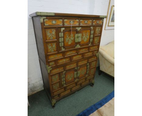 Far Eastern cabinet with panelled and veneered front applied with metal mounts and engraved metal panels of birds and blossom