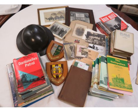 A collection of books, badges and militaria, several items being of Gallipoli and Middlesex Regiment interest, to include an 