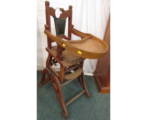 An antique oak child's metamorphic high chair, height in upright position 98cm, sold as a decorative item only