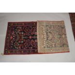 A PERSIAN WOOL RUNNER OR HALL CARPET dark blue ground with large floral design. 9ft 11ins x 3ft
