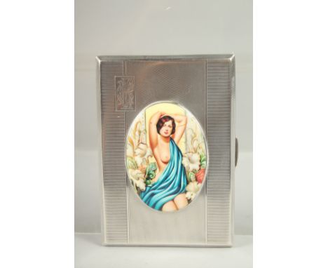 AN ENGINE TURNED SILVER CIGARETTE CASE. Birmingham, 1938 with an oval of glamour semi-nudes..