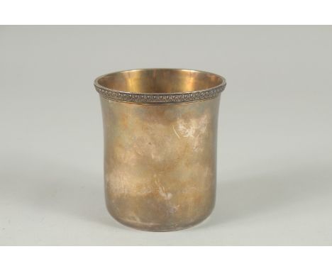 A PLAIN GEORGE III SILVER BEAKER by PAUL STORR. 3.5ins high. Signed, London 1818.