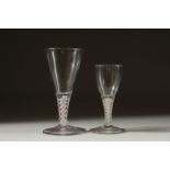 TWO SMALL GEORGIAN GLASSES both with white short stems. 4ins & 5ins high.