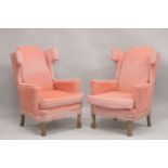 A PAIR OF PINK WING ARM CHAIRS on cabriole legs.