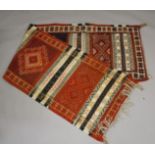 A PERSIAN/ NORTH AFRICAN WOOL RUNNER with bands of sylised decoration. 9ft 10ins x 2ft 8ins.
