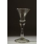 A LARGE PLAIN GEORGIAN GLASS with inverted bell shaped bowl. 6.5ins high.