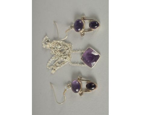 A SILVER AMETHYST NECKLACE AND EARRINGS.