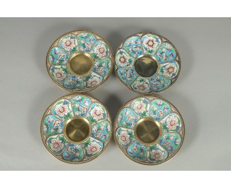 A GOOD SET OF FOUR RUSSIAN SILVER AND ENAMEL SAUCERS. 11.5cm diameter. Mark: Head, 84, A.C. over 1894, one with Faberge mark.