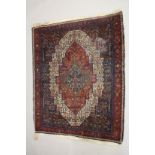 A PERSIAN WOOL CARPET cream, red and blue ground with all over stylised decoration. 4ft 9ins x 4ft