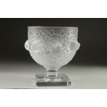 A LALIQUE FROSTED GLASS BOWL surrounded by chubby birds, on a plain square base. Signed Lalique,