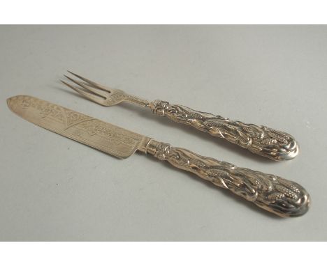 A VICTORIAN CAST SILVER CHRISTENING KNIFE AND FORK. Birmingham 1871.