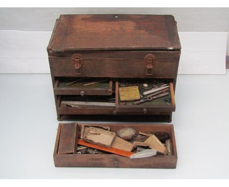An engineers chests with contents including horological tools 
