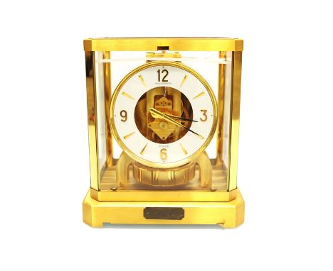 A Jaeger LeCoultre Atmos clock, gilt case with named plaque to base, boxed with original booklets, no. 496326, 23.5cm high