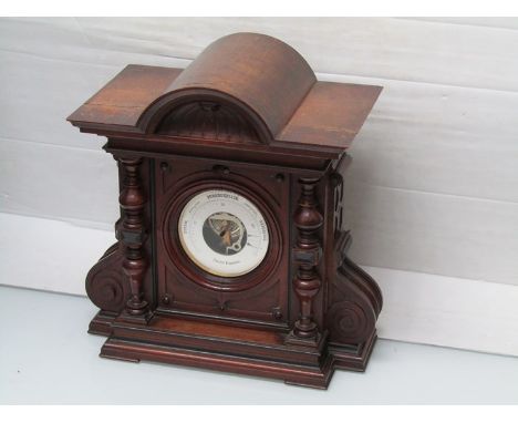 A large Victorian mahogany table aneroid barometer of architectural form with ebonised detail, 55cm high