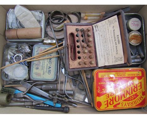 A tray of watchmakers tools and accessories including pegwood, tweezers, punches etc 