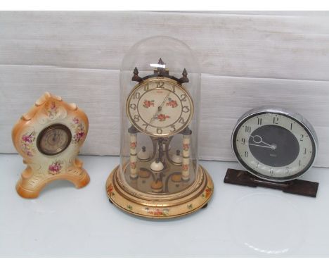 A Kundo anniversary clock, Smith's bakelite timepiece and a ceramic time piece  
