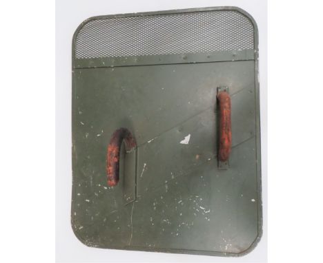 Early Post War British Army Riot Shield green painted, rectangular, alloy shield. The top with mesh visor. Rear fitted with l