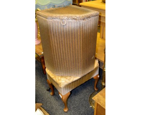 A Lloyd loom laundry basket and stool