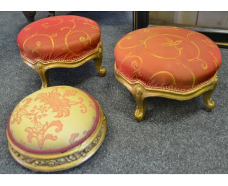 A French Louis XV circular foot stool, the frieze carved with leaves and foliage, 30cm diam, c.1880;  a similar pair (3)