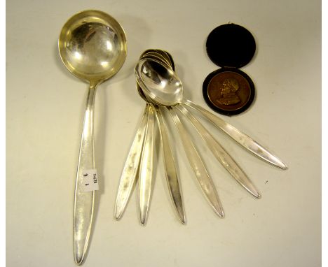 A French silver plated ladle; spoons; a commemorative medallion, cased 