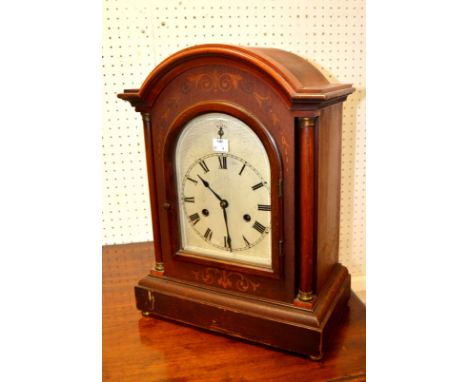A Victorian mahogany mantel clock, circular dial, twin winding holes, Roman numerals, silent chime, turned pilasters, boxwood