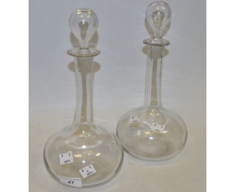 A  pair of Victorian glass globe and shaft decanters