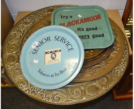 A Senior Service Tobacco at its best enamel tray, another Blackamoor; a large brass charger; others; etc (9)