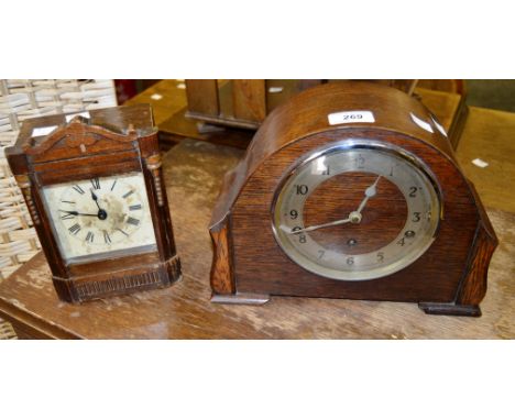 A 1930s oak mantel clock;  another (2)
