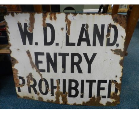 An enamel warning sign from the war department inscribed W. D. Land Entry Prohibited together with an oak framed wall mirror