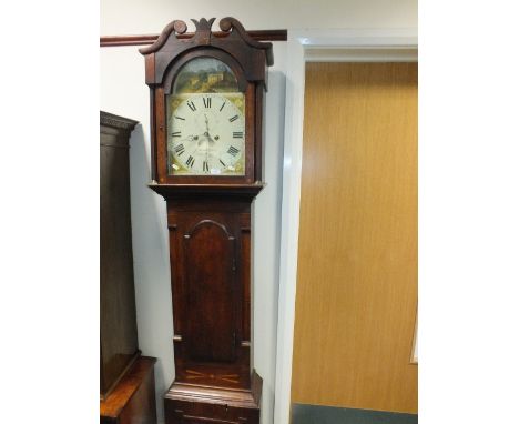 An early 19th century oak and inlaid eight day longcase clock with arched enamel dial, subsidiary seconds dial and date apert