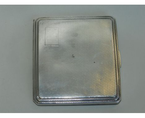 A 1930s silver cigarette case with engine turned decoration