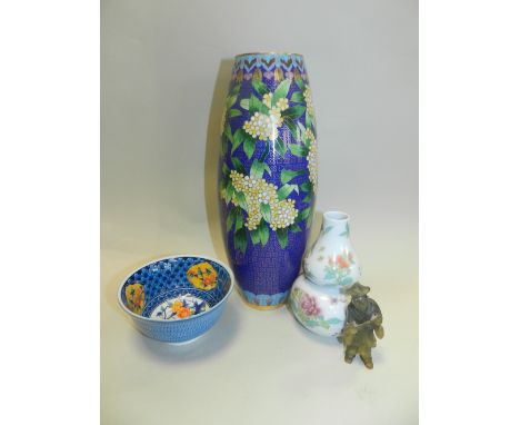 A Chinese famille rose porcelain gourd shaped vase decorated with lotus and chrysanthemum flowers together with a Chinese clo